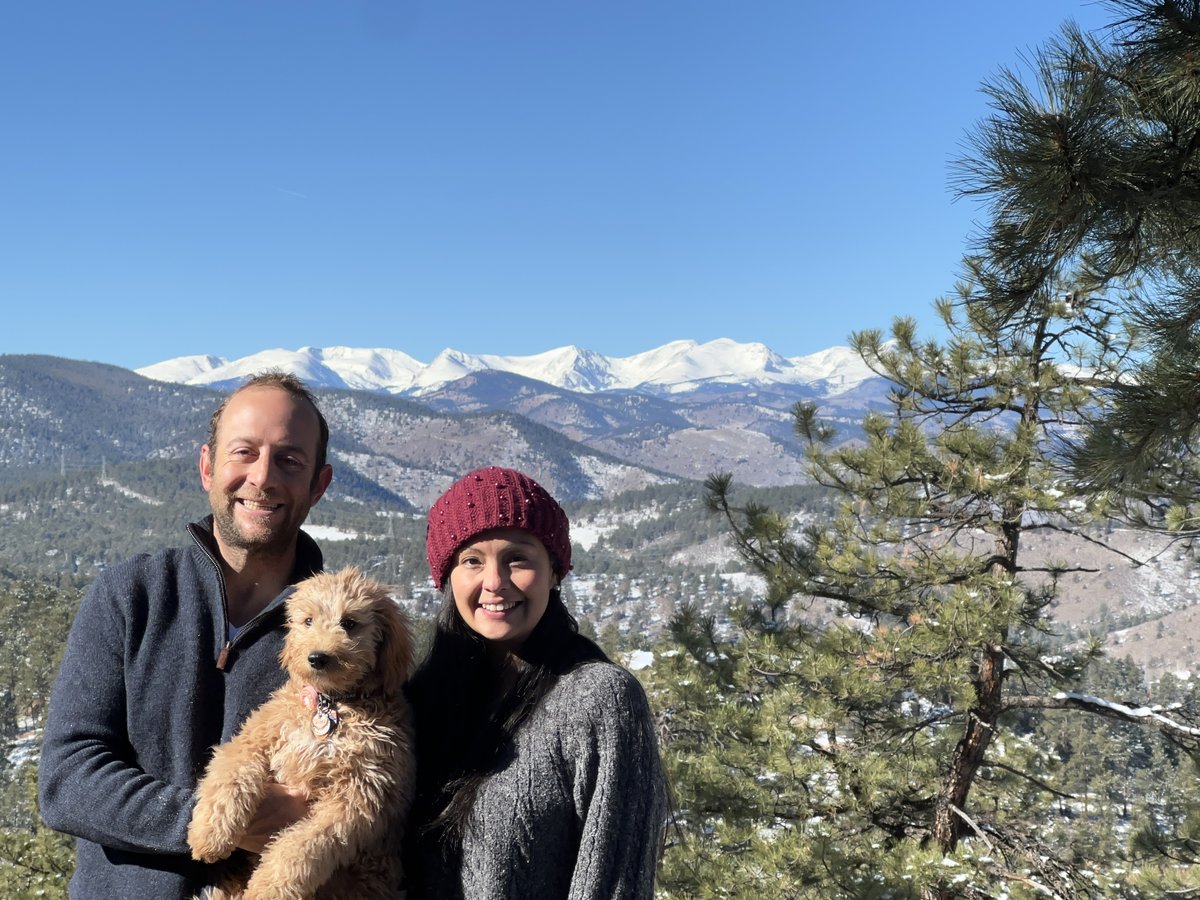 Danny and Mily Dodson with their dog, the Continental Divide behind them
